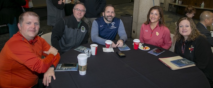 A group of people sitting together at a table